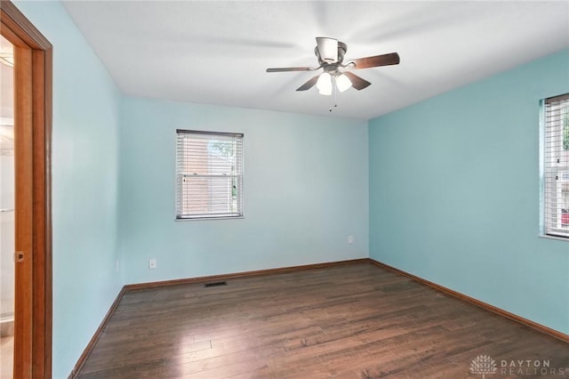 5 Bayberry Dr, Springboro, OH 45066 - empty room featuring healthy amount of natural light, wood finished floors, and ceiling fan