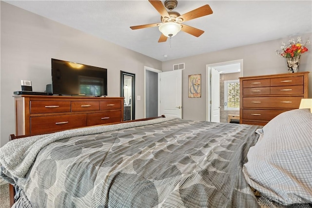 395 Victoria Pl, Waynesville, OH 45068 - bedroom with ceiling fan and connected bathroom