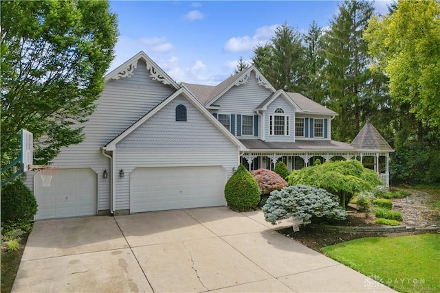 395 Victoria Pl, Waynesville, OH 45068 - view of front of property featuring a garage and concrete driveway