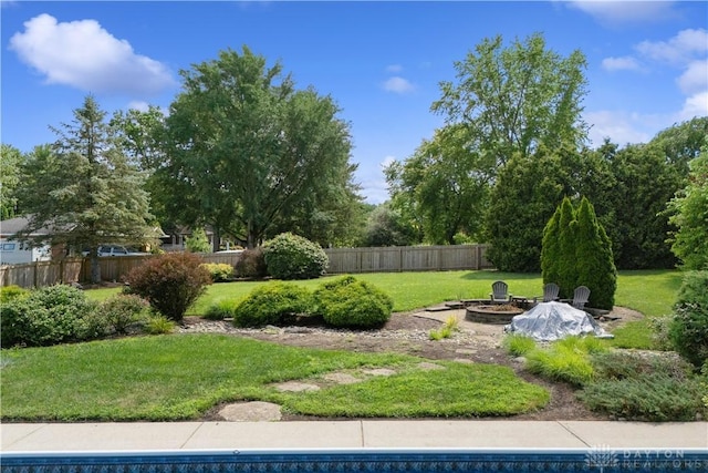 395 Victoria Pl, Waynesville, OH 45068 - fenced yard featuring an outdoor fire pit