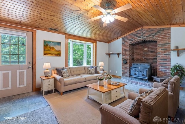 989 Ogden Rd, Adams Twp, OH 45177 - living area with plenty of natural light, wooden ceiling, a ceiling fan, vaulted ceiling, and a wood stove