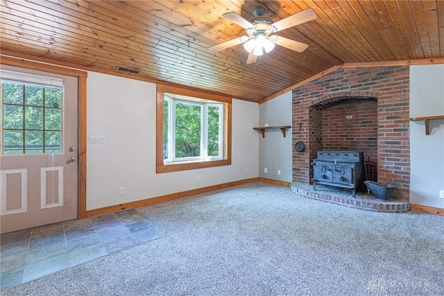 989 Ogden Rd, Adams Twp, OH 45177 - unfurnished living room with wood ceiling, plenty of natural light, a wood stove, a ceiling fan, and lofted ceiling