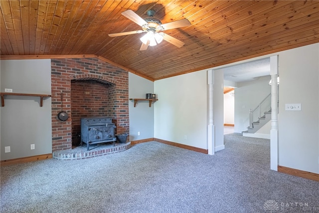 989 Ogden Rd, Adams Twp, OH 45177 - unfurnished living room with carpet flooring, wooden ceiling, a wood stove, ceiling fan, and vaulted ceiling