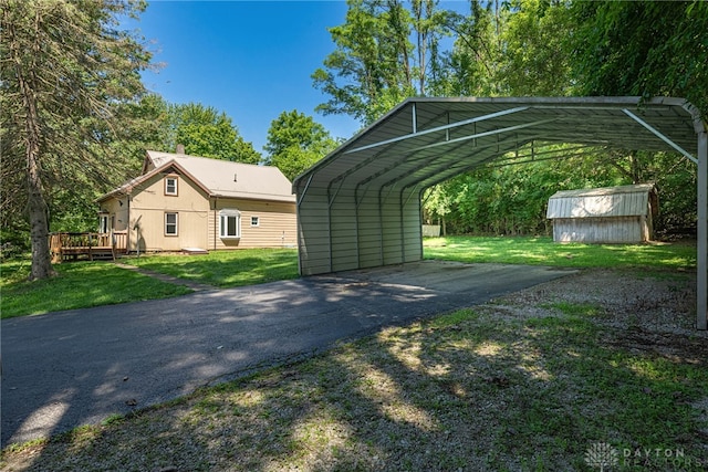 989 Ogden Rd, Adams Twp, OH 45177 - view of parking / parking lot with a storage unit, driveway, and a detached carport