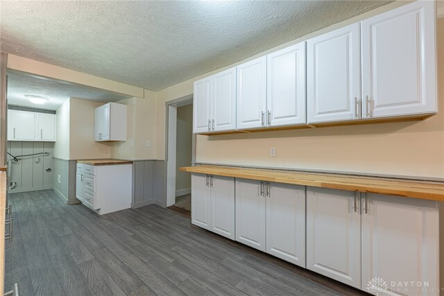 989 Ogden Rd, Adams Twp, OH 45177 - kitchen featuring butcher block counters, dark wood-style flooring, white cabinetry, and a textured ceiling