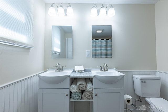 989 Ogden Rd, Adams Twp, OH 45177 - full bath featuring double vanity and wainscoting