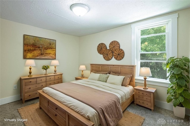 989 Ogden Rd, Adams Twp, OH 45177 - bedroom with light colored carpet and a textured ceiling
