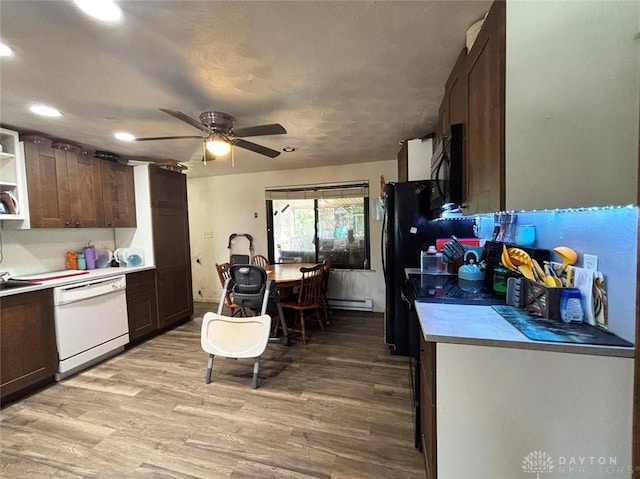 191 Ardmore Dr, Cedarville, OH 45314 - kitchen with dishwasher, open shelves, light wood-type flooring, light countertops, and black microwave