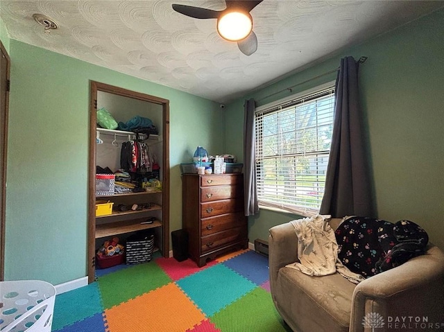 191 Ardmore Dr, Cedarville, OH 45314 - sitting room with carpet, a baseboard heating unit, ceiling fan, and a textured ceiling