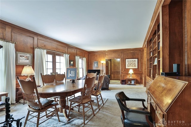 11 Peterson Pl, Wilmington, OH 45177 - dining area with light carpet, wood walls, and built in shelves