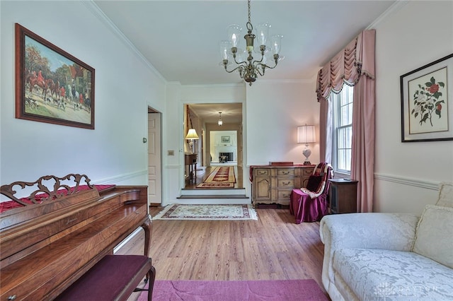 11 Peterson Pl, Wilmington, OH 45177 - entryway with wood finished floors, a chandelier, and ornamental molding