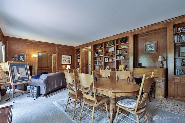 11 Peterson Pl, Wilmington, OH 45177 - carpeted dining room with wooden walls and built in shelves