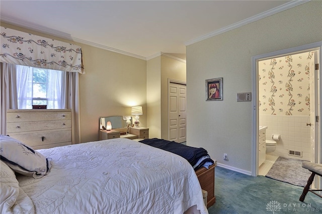 11 Peterson Pl, Wilmington, OH 45177 - carpeted bedroom with crown molding, ensuite bath, a closet, and tile walls