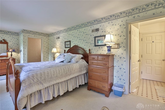 11 Peterson Pl, Wilmington, OH 45177 - bedroom with wallpapered walls and light colored carpet