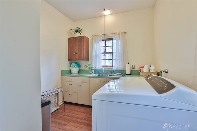 11 Peterson Pl, Wilmington, OH 45177 - laundry room featuring separate washer and dryer, light wood-type flooring, and cabinet space