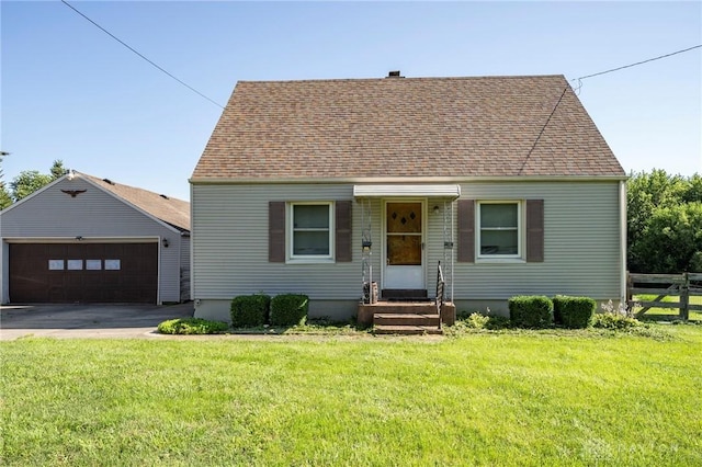 718 Hook Rd, Xenia, OH 45385 - cape cod house with entry steps, a garage, and roof with shingles