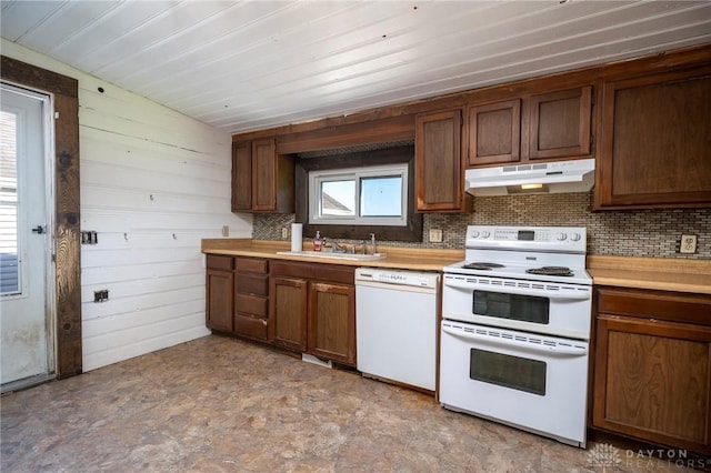 718 Hook Rd, Xenia, OH 45385 - kitchen with white appliances, under cabinet range hood, backsplash, and light countertops
