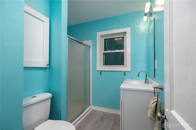 718 Hook Rd, Xenia, OH 45385 - bathroom with vanity, wood finished floors, and a stall shower