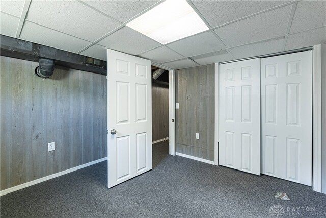 607 Alexander Dr, Dayton, OH 45403 - finished basement featuring a drop ceiling and dark colored carpet