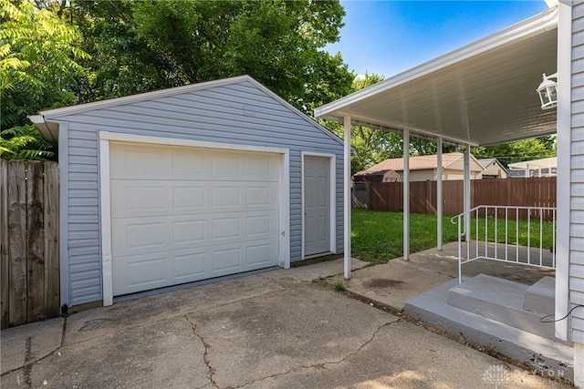 607 Alexander Dr, Dayton, OH 45403 - detached garage featuring driveway