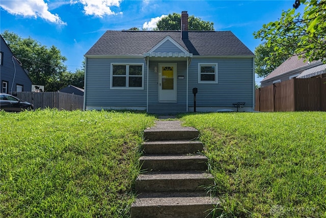 607 Alexander Dr, Dayton, OH 45403 - bungalow-style house featuring entry steps, a chimney, and a shingled roof