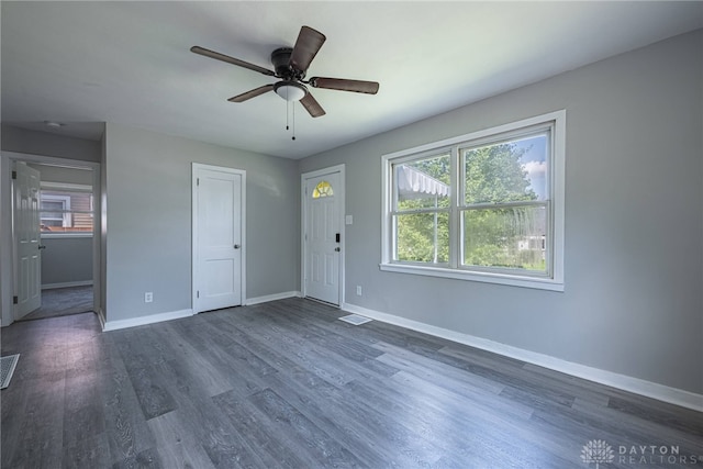 607 Alexander Dr, Dayton, OH 45403 - unfurnished living room featuring dark wood-style floors and ceiling fan