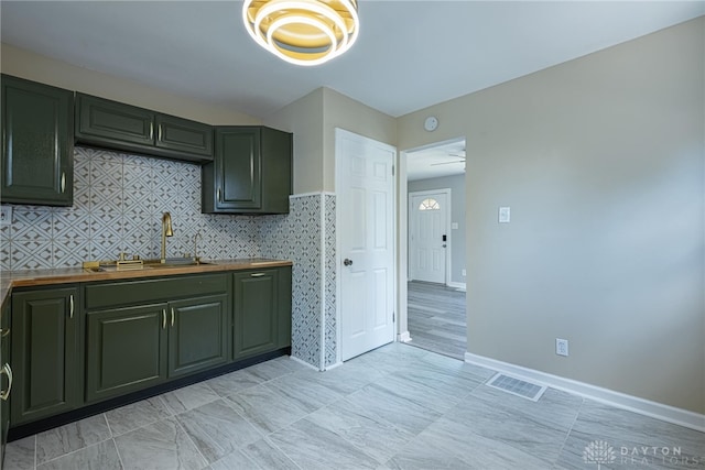 607 Alexander Dr, Dayton, OH 45403 - kitchen featuring wooden counters and a sink