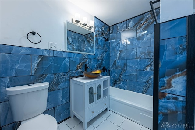 607 Alexander Dr, Dayton, OH 45403 - bathroom with tile walls, vanity, tile patterned flooring, and  shower combination