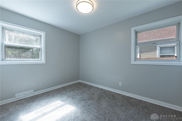 607 Alexander Dr, Dayton, OH 45403 - spare room featuring plenty of natural light and carpet flooring