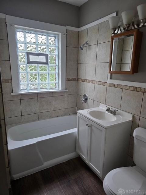 2324 Eastview Unit 2322, Dayton, OH 45405 - bathroom featuring vanity, tile walls, wood finished floors, and shower / bathtub combination
