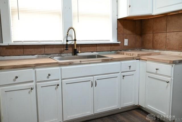 2324 Eastview Unit 2322, Dayton, OH 45405 - kitchen featuring white cabinets, backsplash, and butcher block countertops