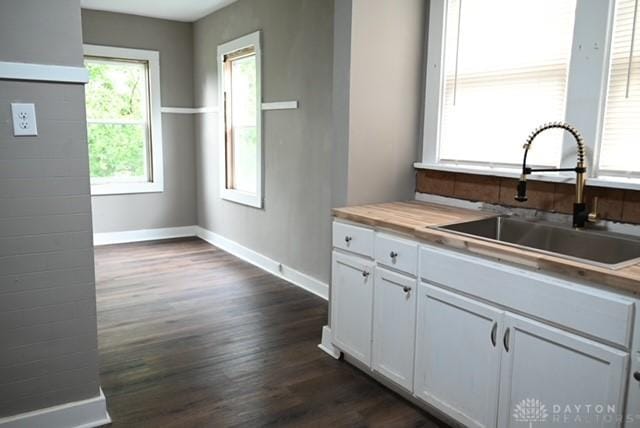 2324 Eastview Unit 2322, Dayton, OH 45405 - kitchen with dark wood-style flooring and white cabinetry