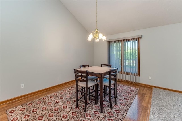 7135 Salem Crossing Pl, Englewood, OH 45322 - dining space with a chandelier, wood finished floors, and lofted ceiling