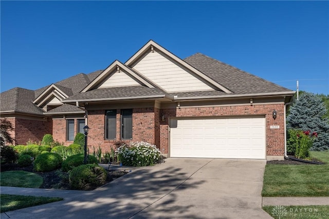 7135 Salem Crossing Pl, Englewood, OH 45322 - view of front of home with driveway, an attached garage, brick siding, and a shingled roof