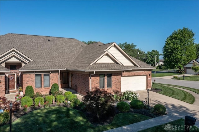 7135 Salem Crossing Pl, Englewood, OH 45322 - view of front of house with a garage, brick siding, driveway, and a shingled roof