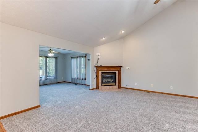 7135 Salem Crossing Pl, Englewood, OH 45322 - unfurnished living room featuring ceiling fan, carpet flooring, lofted ceiling, a tiled fireplace, and recessed lighting