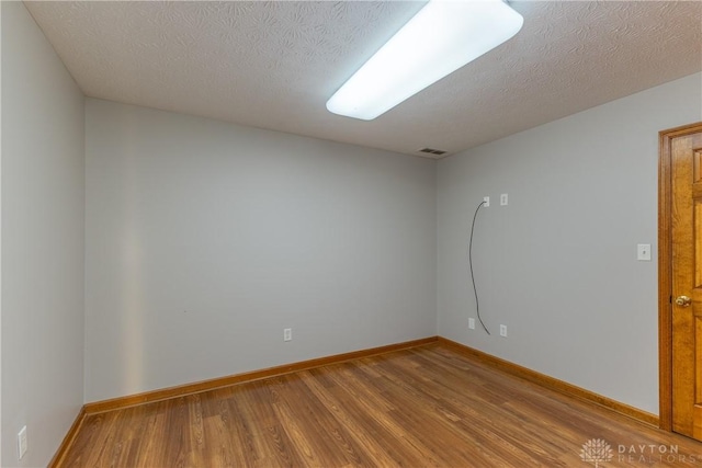 7135 Salem Crossing Pl, Englewood, OH 45322 - unfurnished room with wood finished floors and baseboards