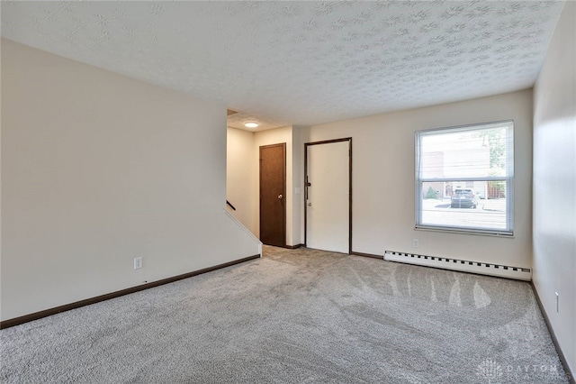 4530 Shawnray Dr Unit 84, Middletown, OH 45044 - spare room featuring a baseboard radiator, carpet, and a textured ceiling