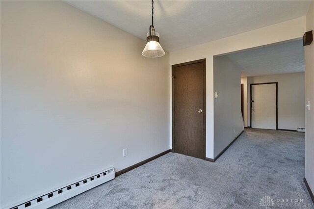 4530 Shawnray Dr Unit 84, Middletown, OH 45044 - carpeted empty room featuring a baseboard heating unit and baseboards
