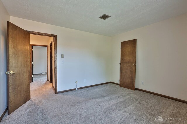 4530 Shawnray Dr Unit 84, Middletown, OH 45044 - unfurnished room featuring carpet floors and a textured ceiling