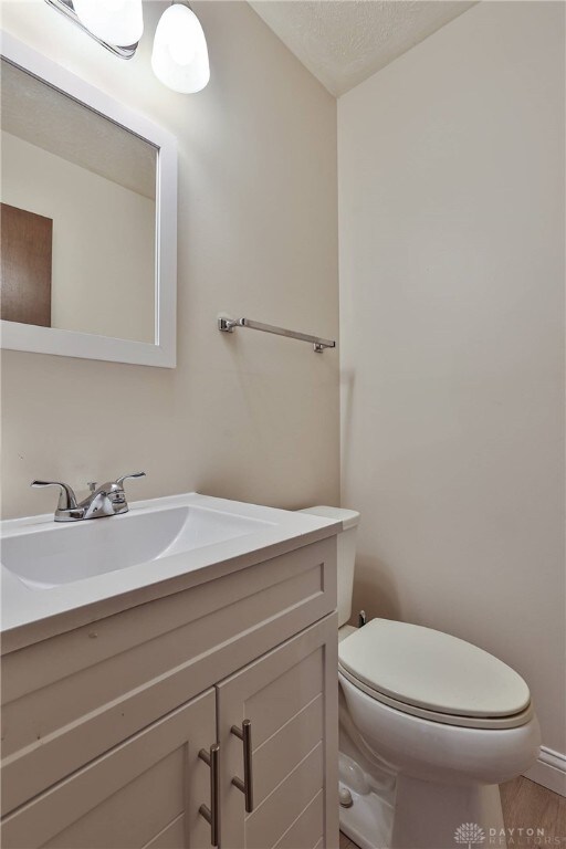 4530 Shawnray Dr Unit 84, Middletown, OH 45044 - half bath featuring vanity and a textured ceiling