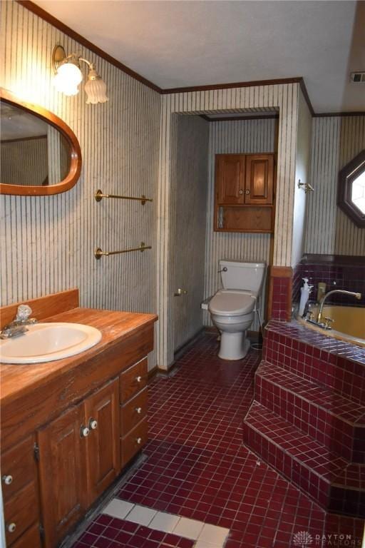 13181 Eaton Pike Unit 13181, New Lebanon, OH 45345 - full bath featuring ornamental molding, wallpapered walls, a garden tub, vanity, and tile patterned flooring