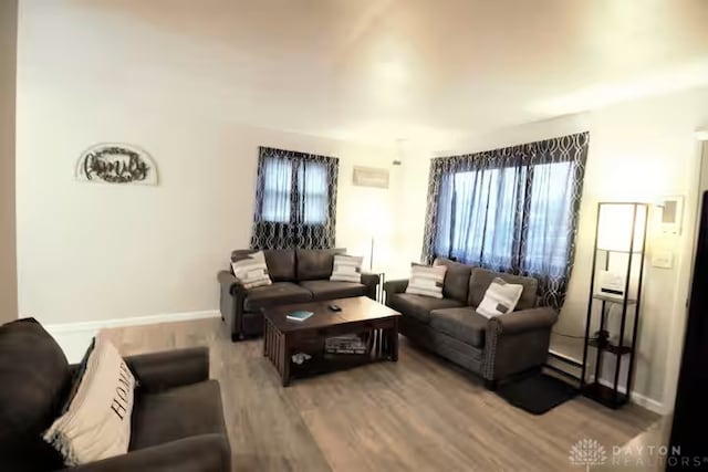 4646 Wayne Meadows Cir Unit 4640, Dayton, OH 45424 - living room featuring wood finished floors and baseboard heating