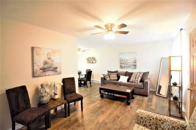 4646 Wayne Meadows Cir Unit 4640, Dayton, OH 45424 - living area featuring a ceiling fan, wood finished floors, and a baseboard radiator