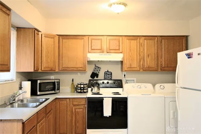4646 Wayne Meadows Cir Unit 4640, Dayton, OH 45424 - kitchen featuring white appliances, under cabinet range hood, washer and dryer, and light countertops