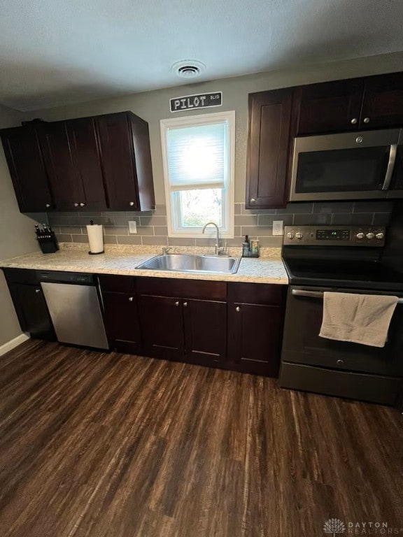 4646 Wayne Meadows Cir Unit 4640, Dayton, OH 45424 - kitchen featuring stainless steel appliances, dark wood-type flooring, and decorative backsplash
