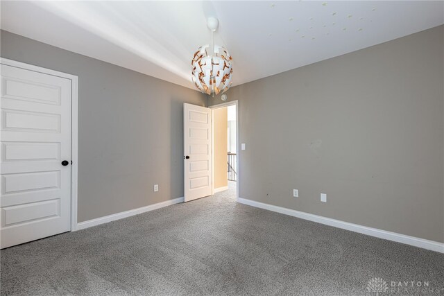 225 Woodstream Dr, Springboro, OH 45066 - spare room featuring a chandelier and carpet flooring