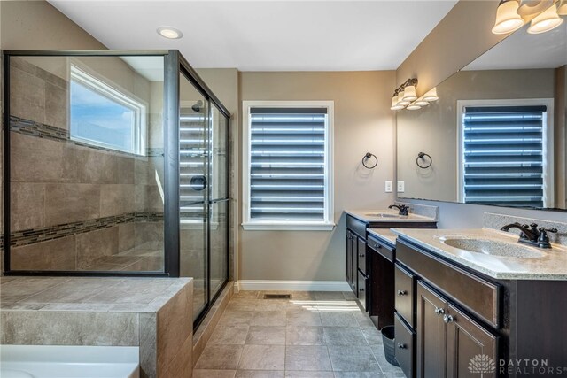 225 Woodstream Dr, Springboro, OH 45066 - full bathroom with vanity, a shower stall, a bathtub, and tile patterned floors