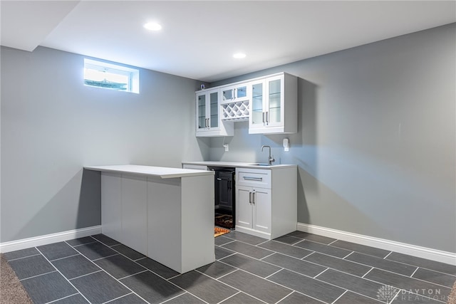 225 Woodstream Dr, Springboro, OH 45066 - kitchen featuring a peninsula, glass insert cabinets, white cabinets, light countertops, and recessed lighting
