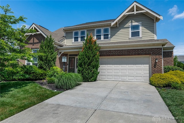 225 Woodstream Dr, Springboro, OH 45066 - view of front of house with brick siding, a garage, driveway, and a front lawn